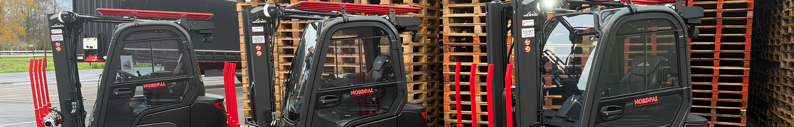 Nordtrans forklift trucks handling pallets in a warehouse to support efficient logistics and transport operations
